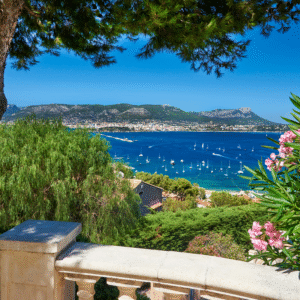 Panoramic view of Nice on the French Riviera overlooking the Mediterranean Sea with lush gardens and the Baie des Anges.